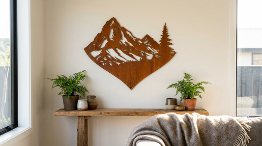 Rusty Corten steel mountain and heart wall art hanging on the wall of a New Zealand home