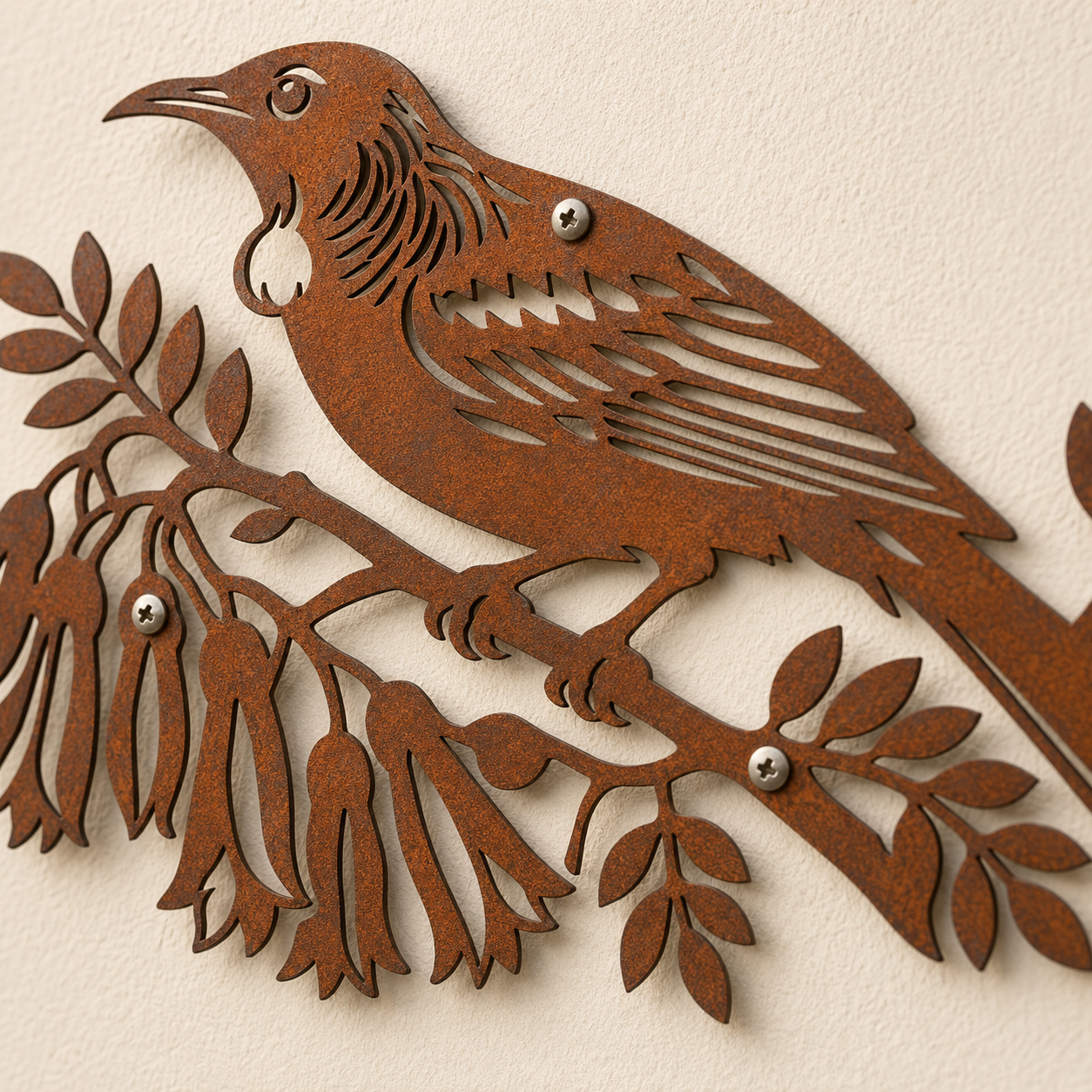 Close-up of laser-cut Corten steel Tui Bird wall art