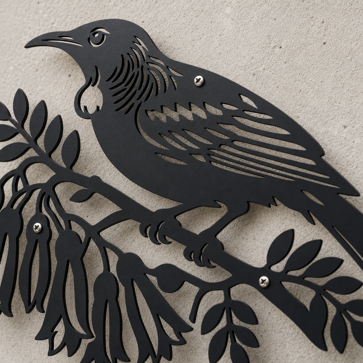 Close-up of powder-coated black Tui Bird wall art