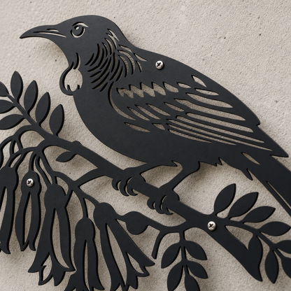 Close-up of powder-coated black Tui Bird wall art